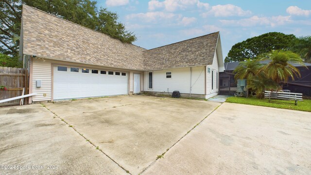 view of side of property with a garage