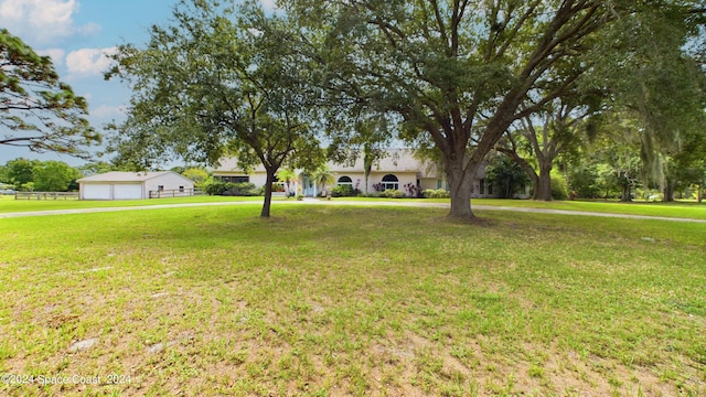 view of yard featuring a garage