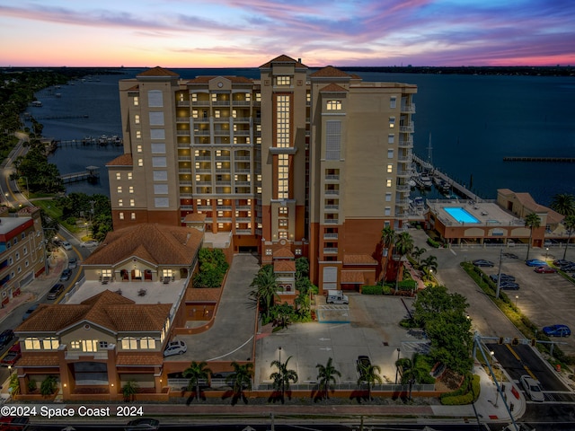 aerial view at dusk with a water view