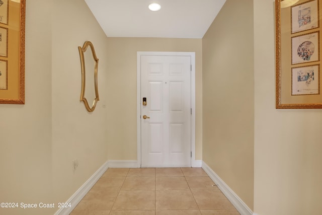 doorway to outside featuring light tile patterned floors