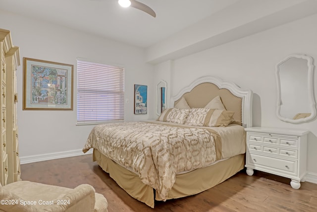 bedroom with ceiling fan and hardwood / wood-style floors