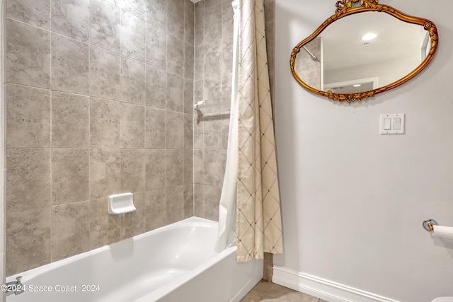 bathroom featuring tile patterned floors and shower / bath combo