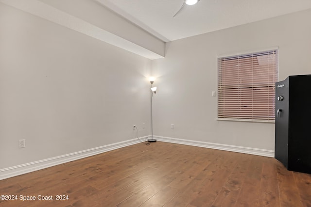 unfurnished room with hardwood / wood-style flooring