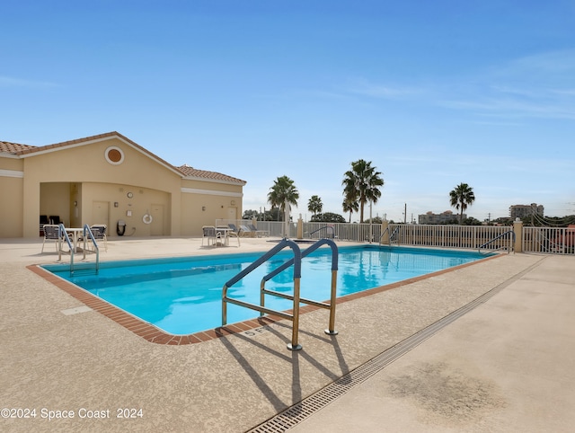 view of pool featuring a patio