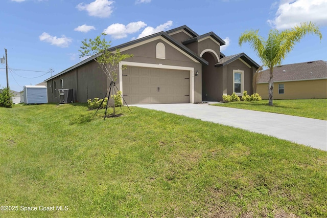 539 Hamwood St SW, Palm Bay, FL 32908 - single story home featuring stucco siding, concrete driveway, an attached garage, and a front yard