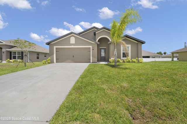 539 Hamwood St SW, Palm Bay, FL 32908 - single story home with an attached garage, concrete driveway, and stucco siding