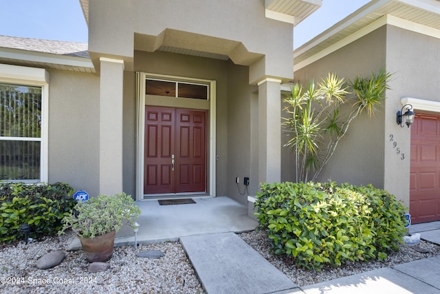 property entrance with a garage