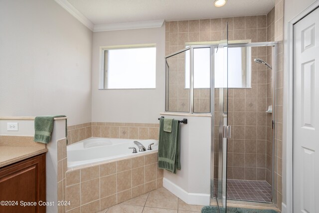 bathroom with tile patterned flooring, vanity, independent shower and bath, and a healthy amount of sunlight