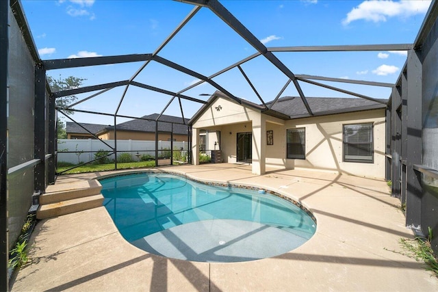 view of swimming pool featuring a patio area, a fenced in pool, a lanai, and fence