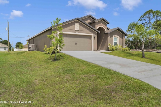 2270 Harbison Ave SW, Palm Bay, FL 32908 - ranch-style home featuring concrete driveway, stucco siding, an attached garage, and a front lawn