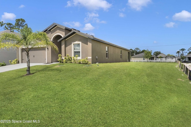 2270 Harbison Ave SW, Palm Bay, FL 32908 - view of front of house with stucco siding, driveway, and an attached garage