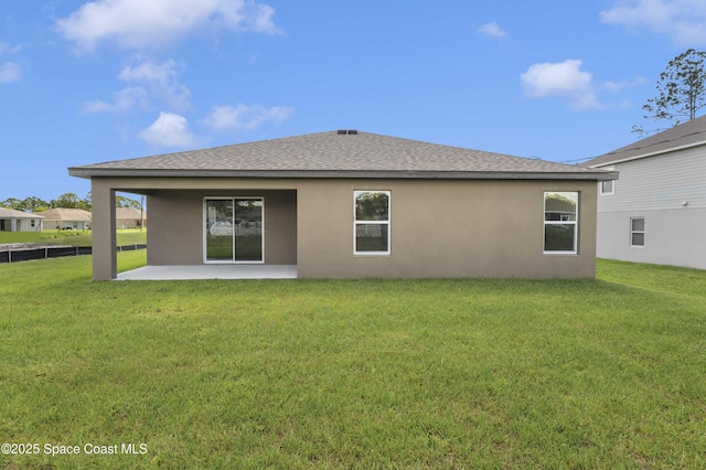2270 Harbison Ave SW, Palm Bay, FL 32908 - rear view of house featuring stucco siding, a patio, and roof with shingles