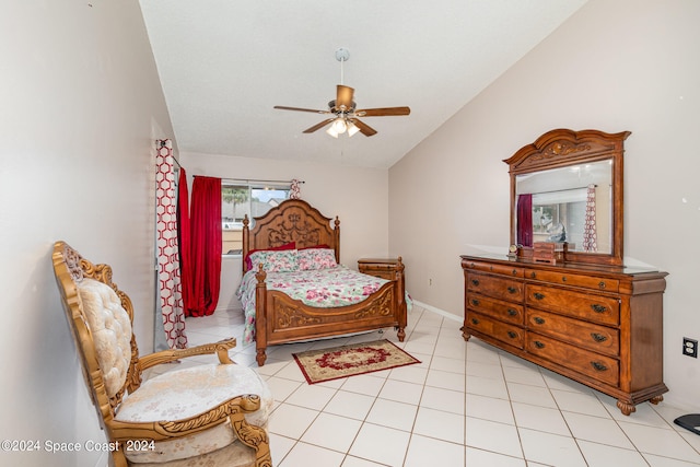 tiled bedroom featuring lofted ceiling and ceiling fan