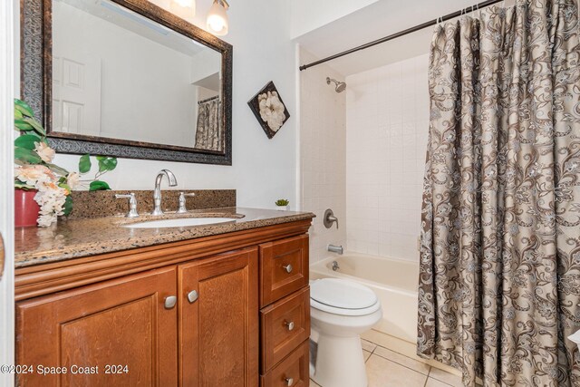 full bathroom with vanity, toilet, shower / bath combination with curtain, and tile patterned floors