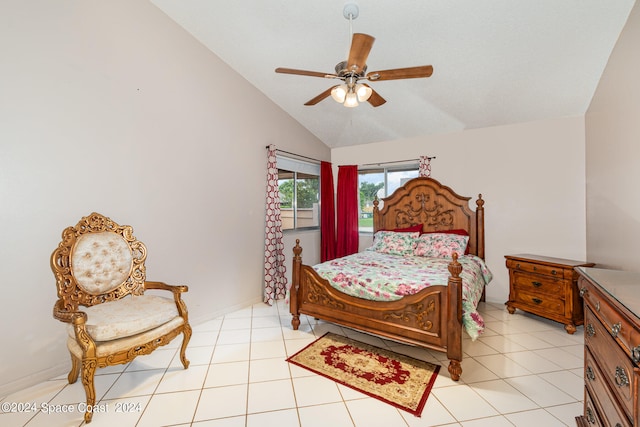 bedroom with ceiling fan, light tile patterned floors, and vaulted ceiling