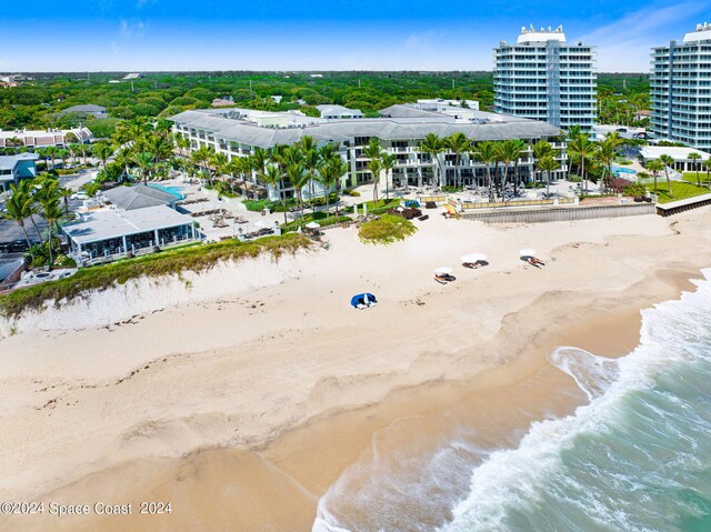 drone / aerial view with a view of the beach and a water view