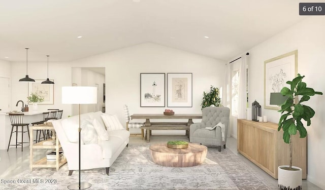 living room featuring vaulted ceiling