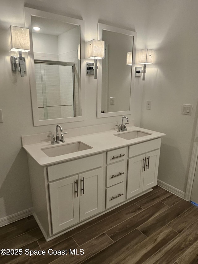 bathroom featuring vanity and an enclosed shower