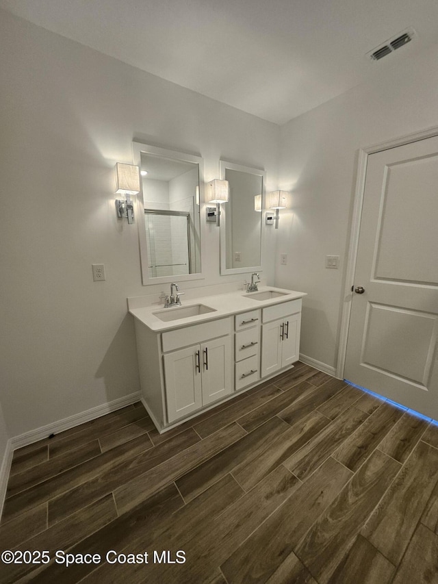 bathroom with vanity and an enclosed shower