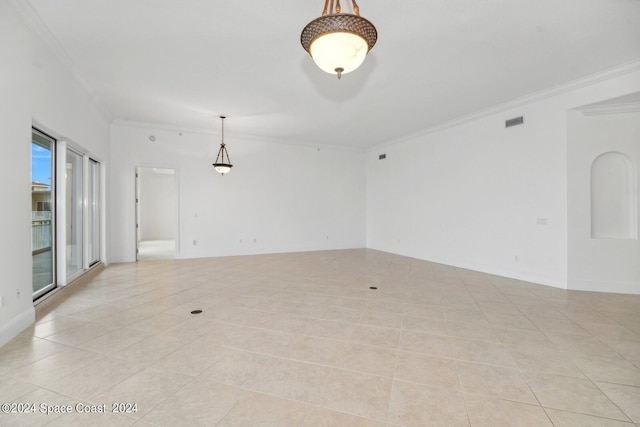 unfurnished room with crown molding, light tile patterned floors, baseboards, and visible vents