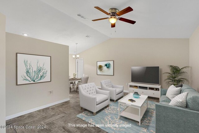 living room with ceiling fan with notable chandelier, parquet floors, and lofted ceiling