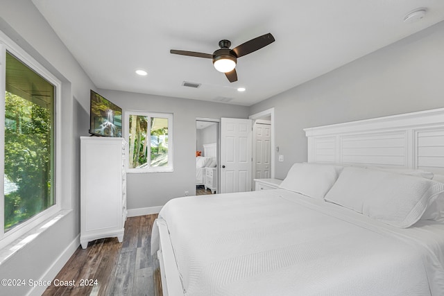 bedroom with dark wood-type flooring and ceiling fan