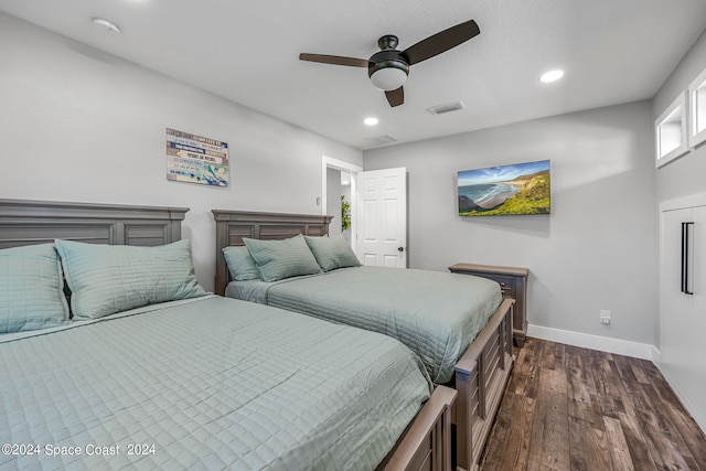 bedroom featuring ceiling fan and dark hardwood / wood-style floors