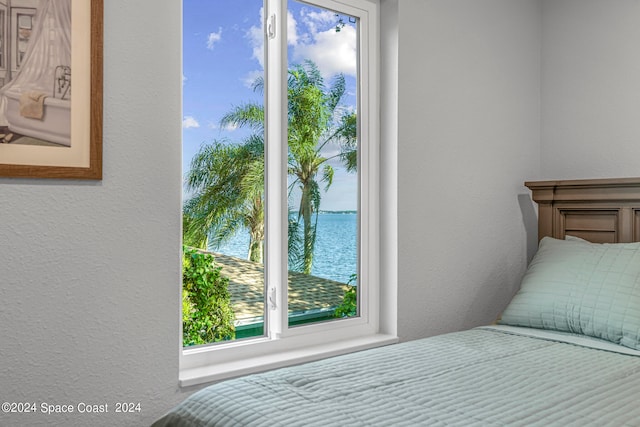 bedroom with a water view