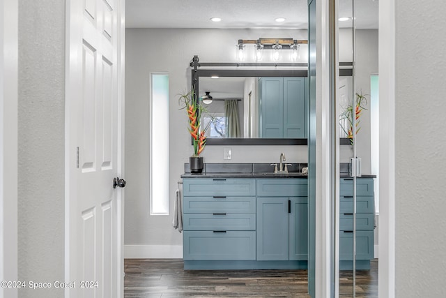 bathroom with vanity and hardwood / wood-style flooring