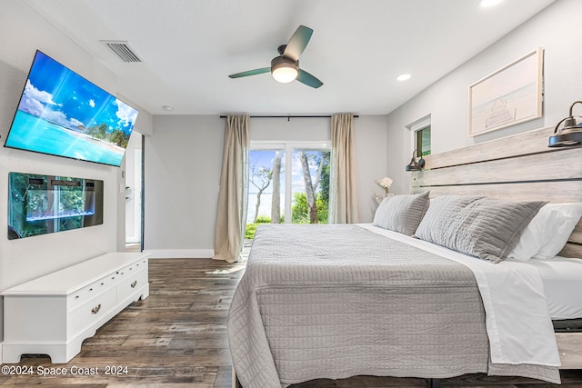 bedroom with dark wood-type flooring and ceiling fan