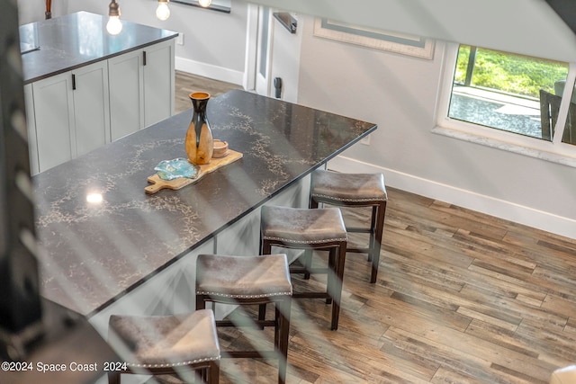 dining area with hardwood / wood-style floors