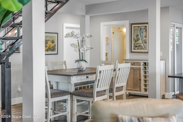 dining space with hardwood / wood-style flooring