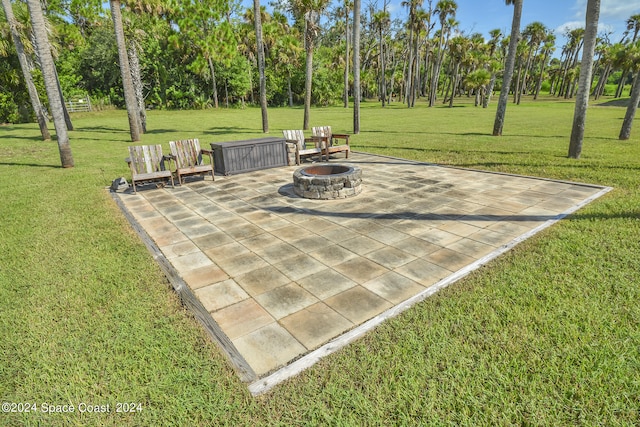 view of patio / terrace with an outdoor fire pit