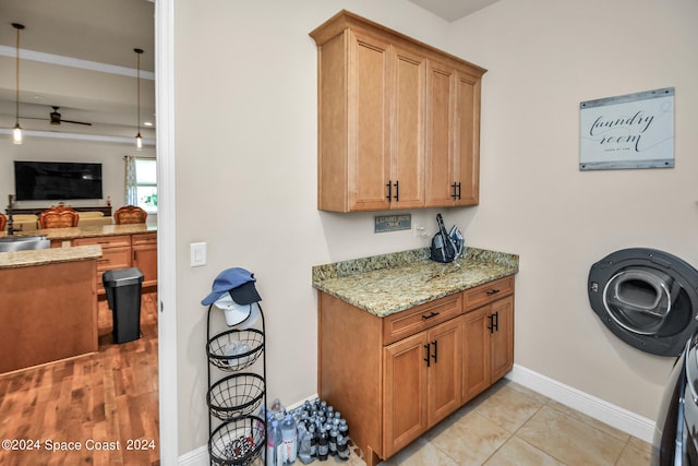 kitchen featuring light stone countertops and light tile patterned flooring