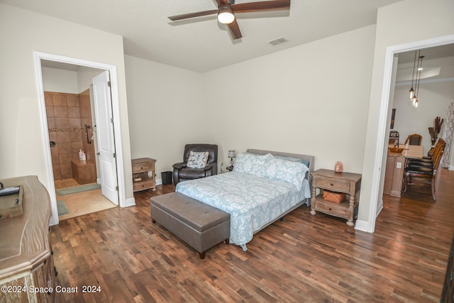 bedroom with ensuite bath, dark hardwood / wood-style flooring, and ceiling fan