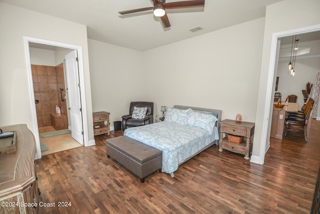 bedroom featuring a ceiling fan, wood finished floors, visible vents, and baseboards