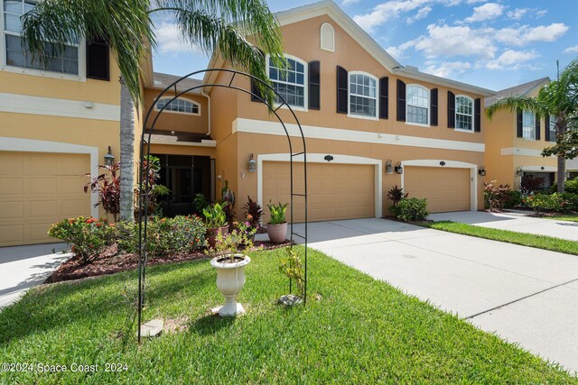 multi unit property featuring a garage