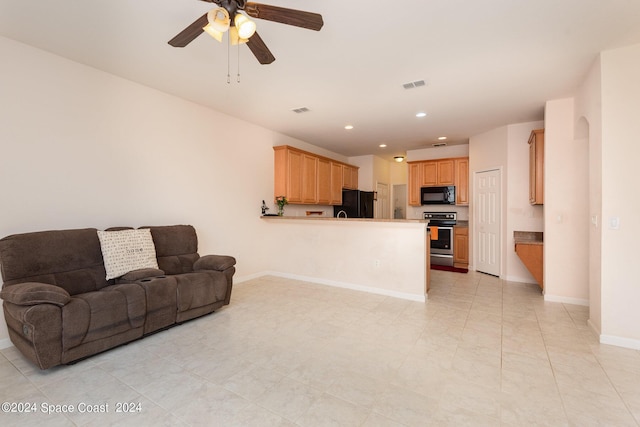 living room featuring baseboards, visible vents, a ceiling fan, and recessed lighting