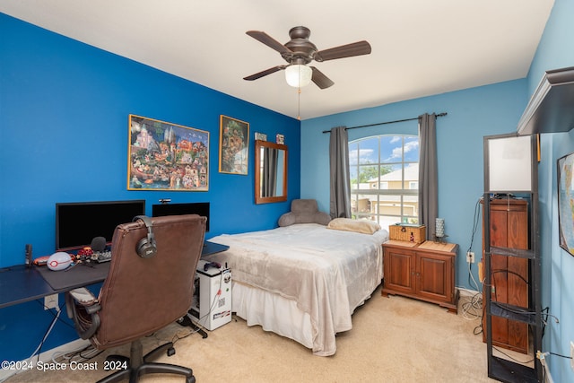 bedroom with light colored carpet and ceiling fan