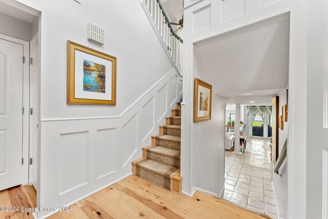 staircase featuring wood-type flooring