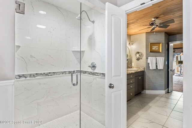 bathroom with ceiling fan, a shower with door, wood ceiling, and vanity