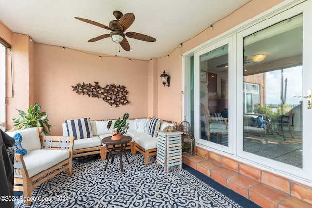 view of patio with ceiling fan and outdoor lounge area