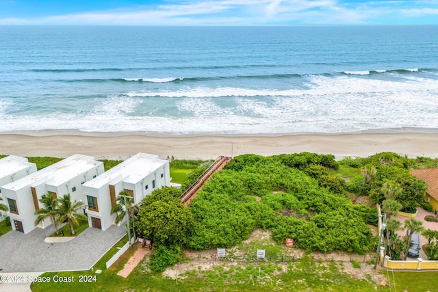 bird's eye view featuring a beach view and a water view