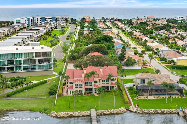 bird's eye view with a water view and a residential view