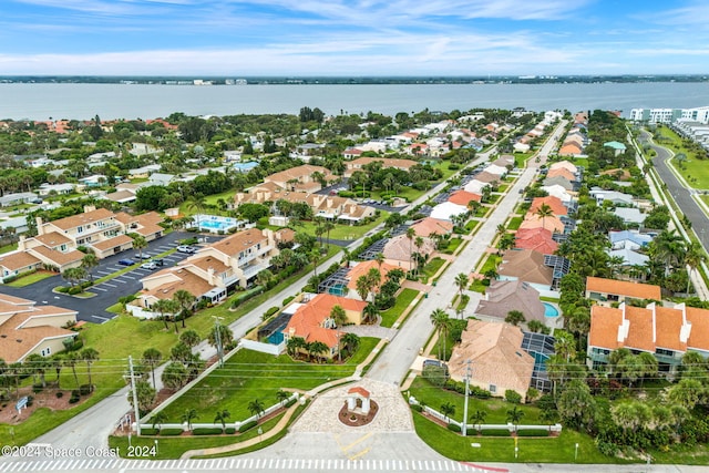 birds eye view of property featuring a residential view and a water view