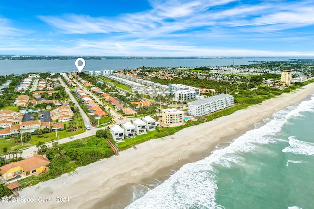 aerial view featuring a water view and a view of the beach