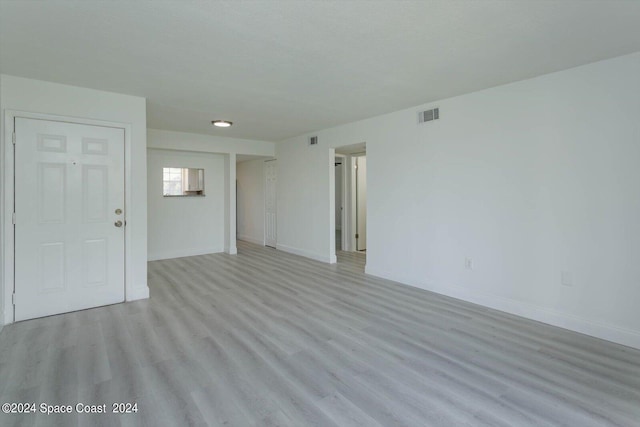 spare room featuring light hardwood / wood-style flooring