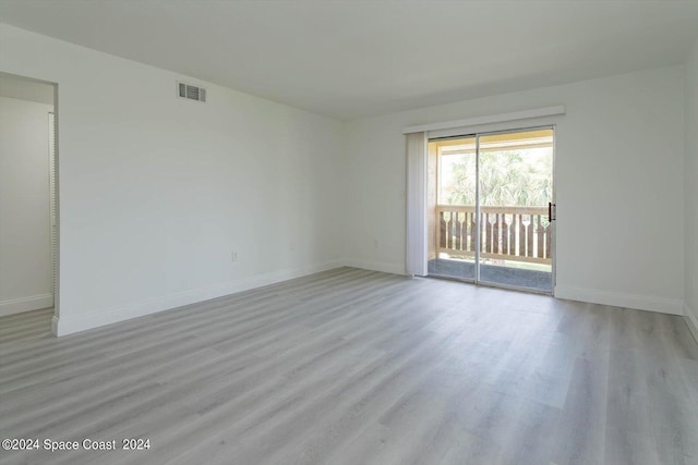 250 Berkshire Ln, Melbourne, FL 32935 - unfurnished room with visible vents, baseboards, and wood finished floors