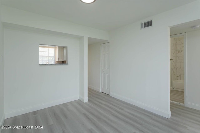 250 Berkshire Ln, Melbourne, FL 32935 - spare room with visible vents, baseboards, and wood finished floors