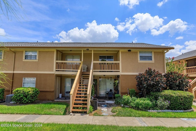 250 Berkshire Ln, Melbourne, FL 32935 - view of building exterior featuring stairway and central AC